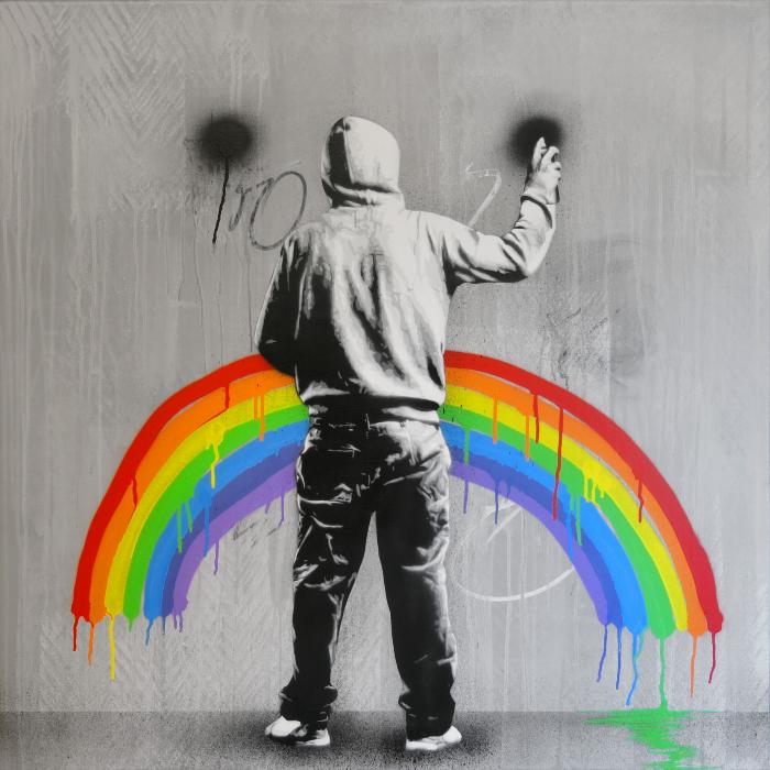 Untitled (person wearing a hoodie, painting a rainbow)