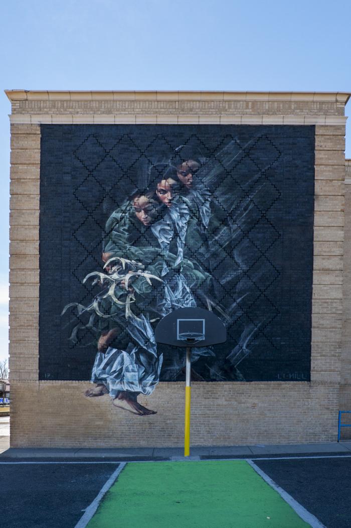 Untitled (three figures holding antlers)