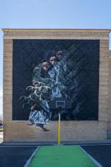 Untitled (three figures holding antlers)