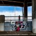 Untitled (two murals - black and white locomotive engine, boy holding a boom box) 