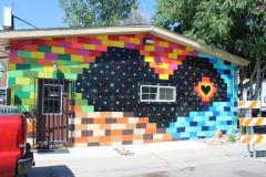 Untitled (black heart amidst colorful bricks)