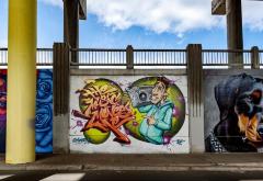 Untitled (young man holding a boom box with stylized graffiti words "The Music Moves Me" )