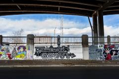 Untitled (two murals - black and white locomotive engine, boy holding a boom box) 