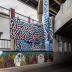 Untitled (collection of three murals: black and white hands facing up, red and blue organic lines, silly faces below) 