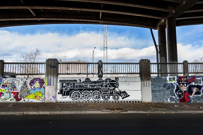 Untitled (two murals - black and white locomotive engine, boy holding a boom box) 