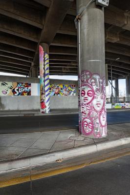 Untitled (concrete columns - pink faces, blue and green candle, bunny with ice cream cone) 