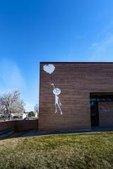 Untitled (boy holding floating balloon)