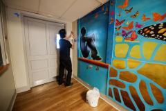 Untitled (hands releasing a monarch butterfly)