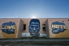 Untitled (a black man with words on hand fists of "Love" and "Hate" 