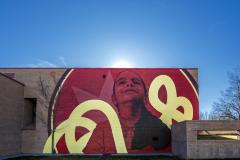 Untitled (girl with a smiling face with a red background and yellow-painted ribboned colors) 