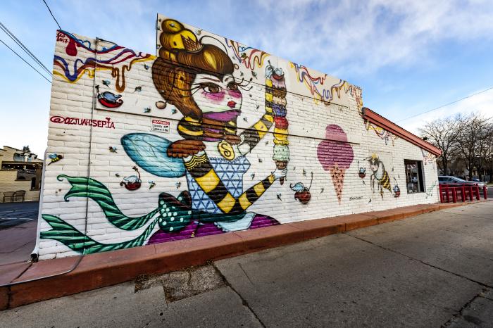 Untitled (a girl holding ice cream cone with many flavors) 