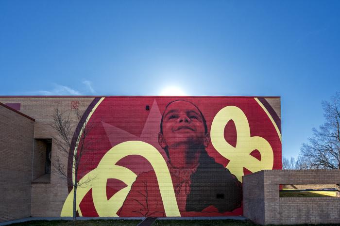 Untitled (girl with a smiling face with a red background and yellow-painted ribboned colors) 
