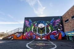 Untitled (hummingbirds frame a basketball hoop)