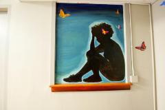 Untitled (a silhouette of a girl sitting on the floor)