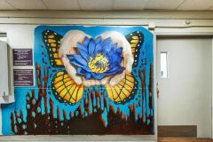 Untitled (hands holding a lotus flower, monarch butterfly) 